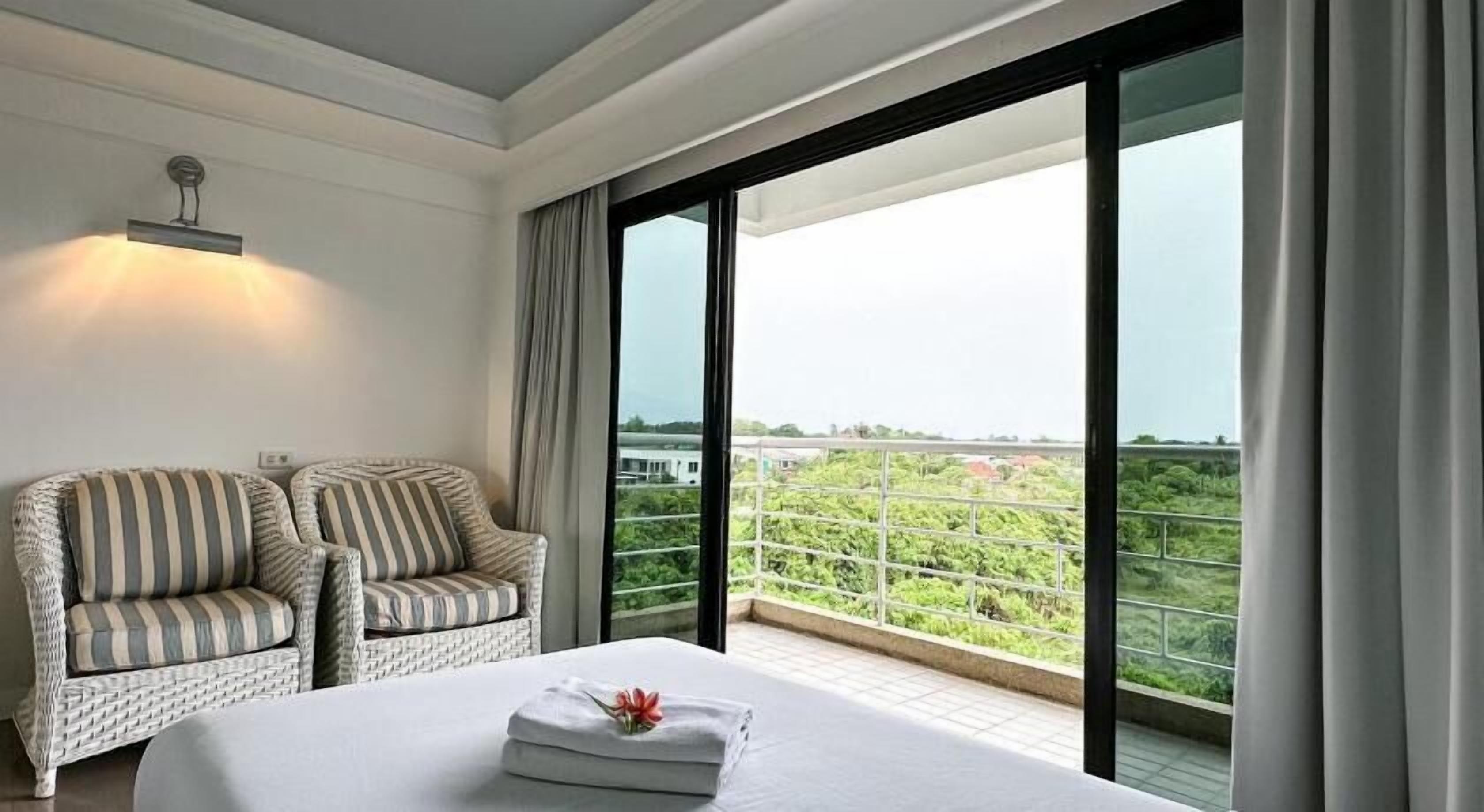 Desk, laptop workspace, blackout drapes, rollaway beds