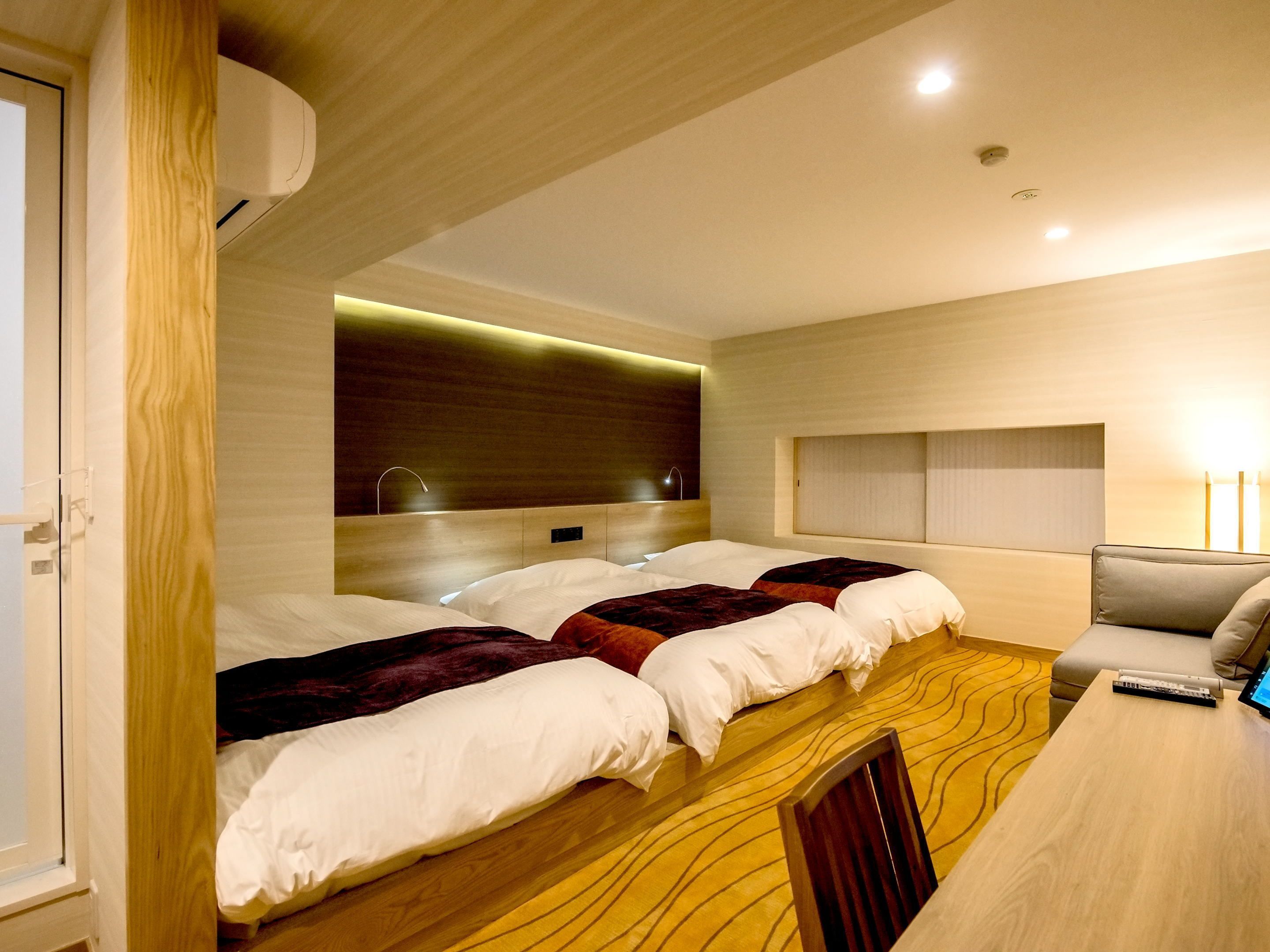 family twin room, non smoking (semi-underground) | down duvets, in-room safe, blackout curtains, soundproofing