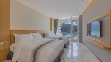 Family Quadruple Room, Lake View | Desk, laptop workspace, blackout drapes, soundproofing