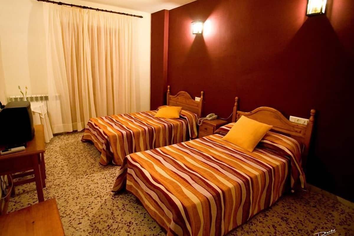 Desk, blackout curtains, rollaway beds, free WiFi