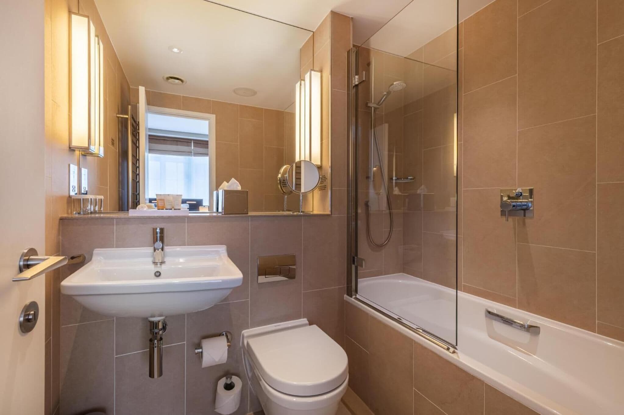 rainfall showerhead, eco-friendly toiletries, hair dryer, towels