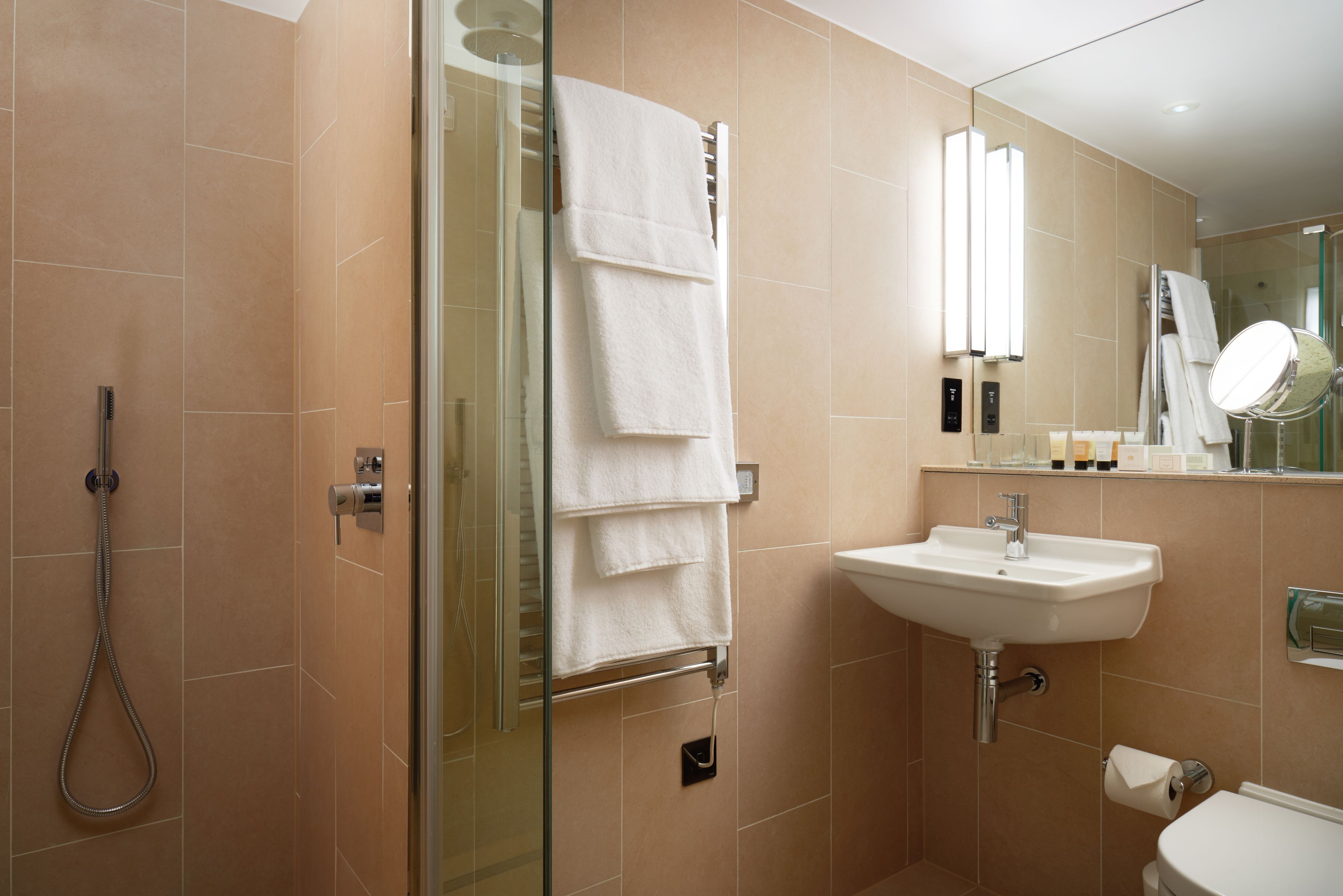 rainfall showerhead, eco-friendly toiletries, hair dryer, towels