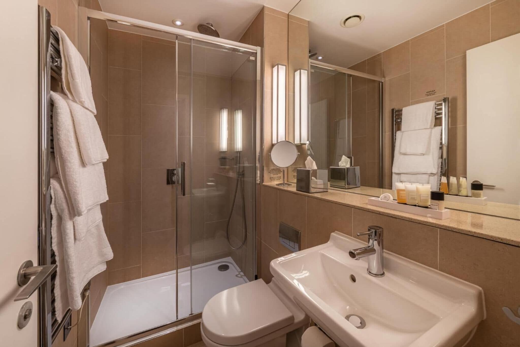 rainfall showerhead, eco-friendly toiletries, hair dryer, towels