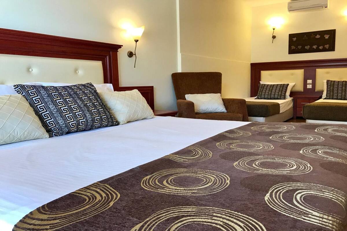 superior triple room, garden view, ground floor | free wifi, bed sheets