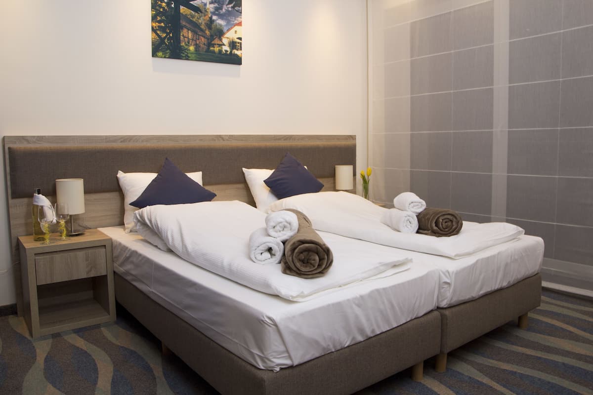 standard double or twin room | premium bedding, minibar, desk, blackout curtains