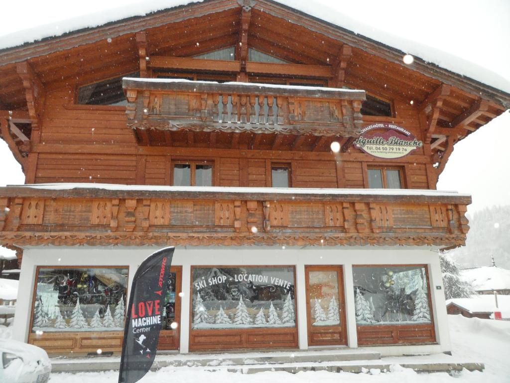 A wooden building with a ski shop and a flag indicating a love machine center.