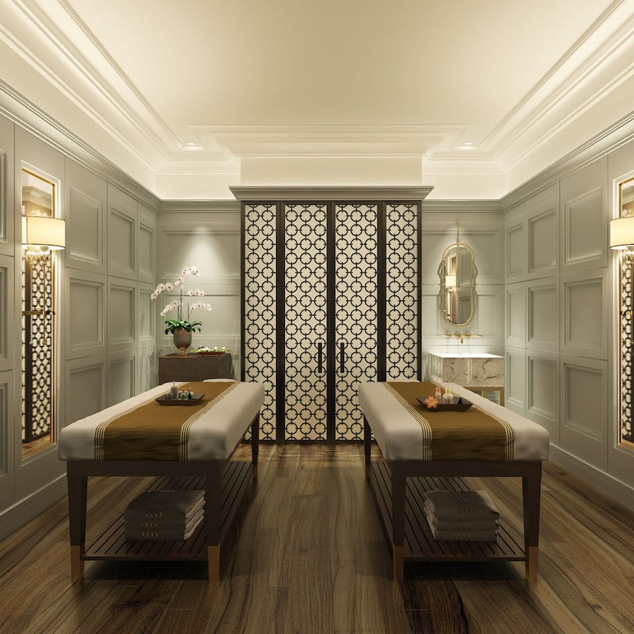 A room with two wooden benches, a decorative wall panel, and two wall-mounted lamps.