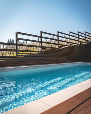 Outdoor pool, open 10 AM to 7 PM, pool umbrellas, sun loungers