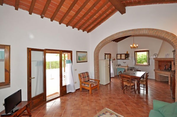 Panoramic Villa, 2 Bedrooms | Living area | TV, fireplace - Cuccardino (Bibbona)