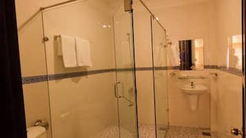 Shower, free toiletries, slippers, towels