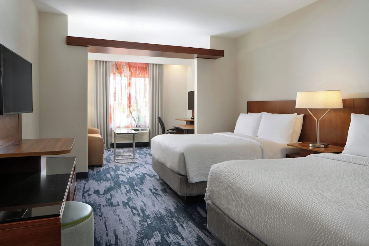 suite, multiple beds | in-room safe, desk, iron/ironing board, rollaway beds