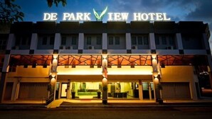 The exterior of De Park View Hotel with a prominent illuminated sign, a modern architectural design, and a well-lit entrance. - De ParkView Hotel (Ipoh)