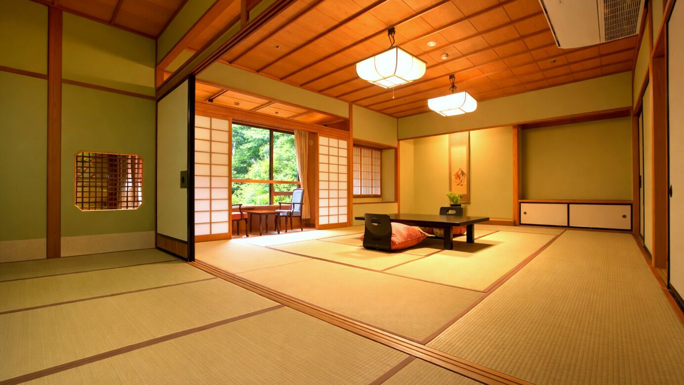 A traditional Japanese room with tatami flooring, a sliding door leading to a garden, and a low table with cushions.