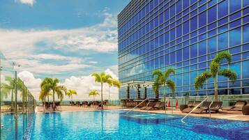 Outdoor pool, open 8:00 AM to 8:00 PM, pool loungers