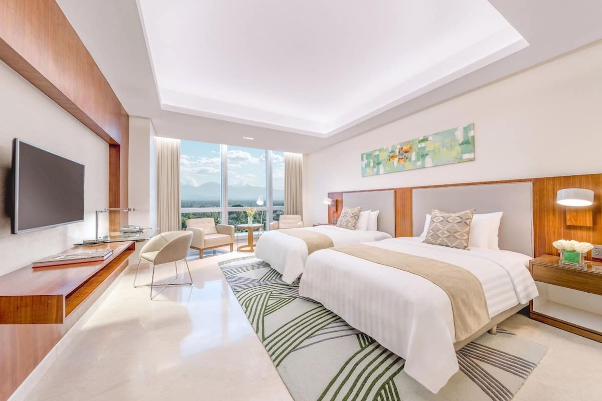 Premium bedding, down comforters, minibar, in-room safe