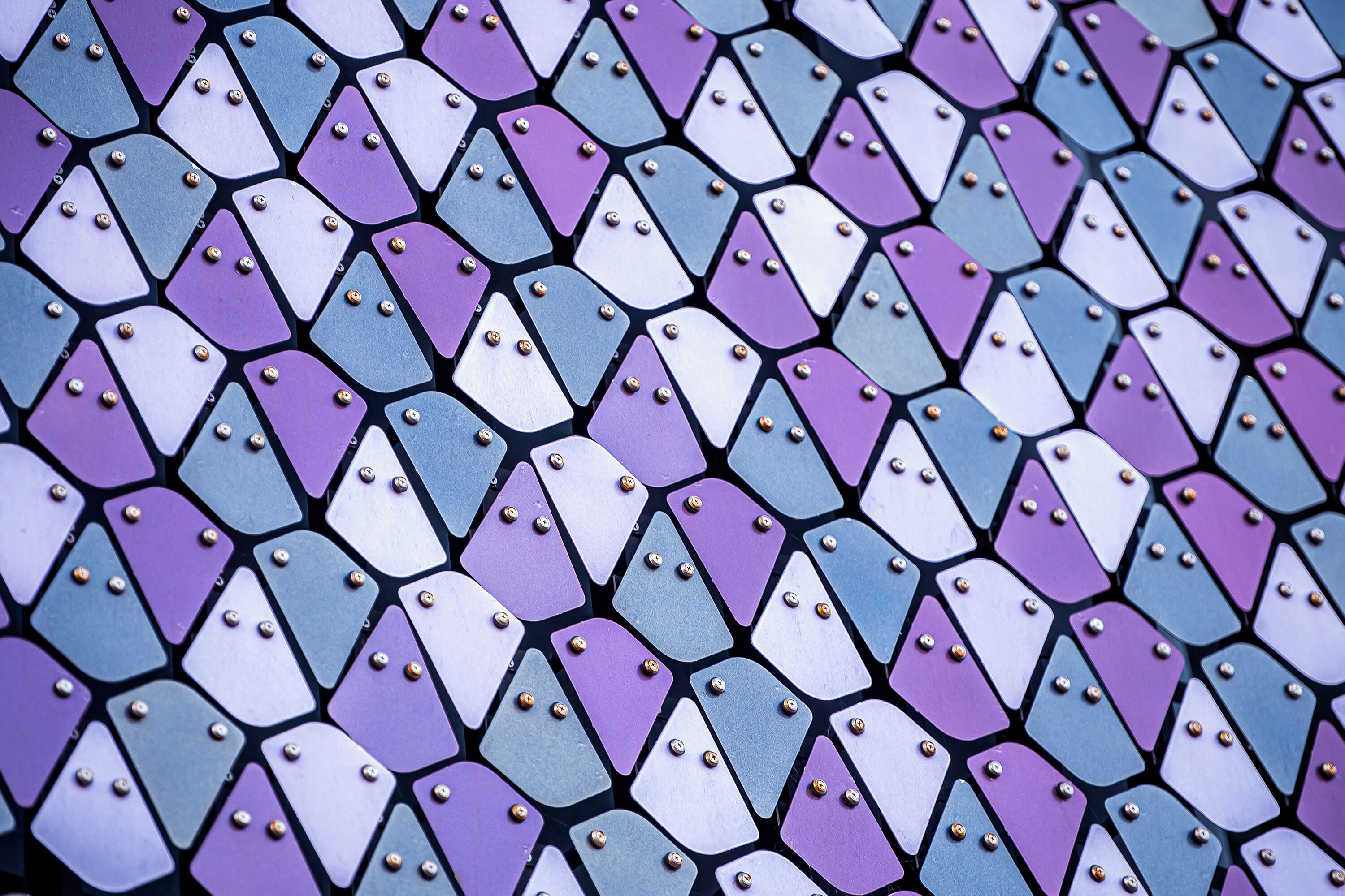 A patterned floor with interlocking tiles in shades of purple and blue.