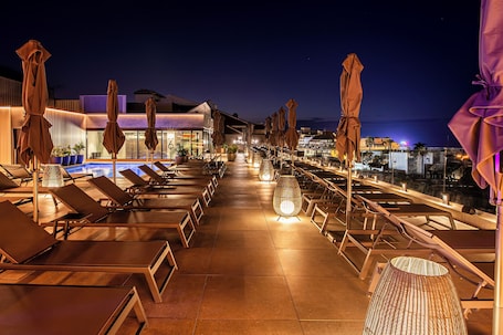 Outdoor pool, open 10:00 AM to 6:00 PM, pool umbrellas, sun loungers