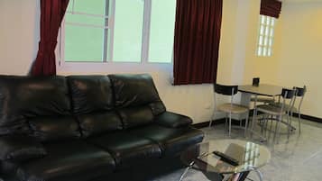 Superior Room | Living area | 21-inch TV with cable channels