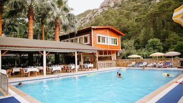 Outdoor pool, open 9:00 AM to 6:00 PM, pool umbrellas, sun loungers