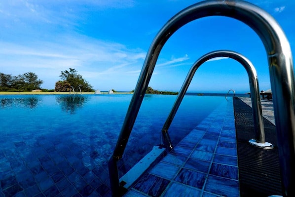 Indoor pool, outdoor pool, open 8 AM to 9 PM, sun loungers