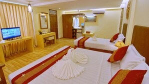 A hotel room with two beds, a desk, a television, and a wardrobe. - Hotel Yadanarbon Bagan (Nyaung-U)