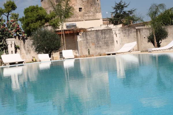 Outdoor pool, pool umbrellas, sun loungers