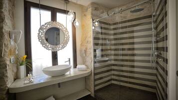 Deluxe Quadruple Room, Balcony | Bathroom | Shower, free toiletries, hair dryer, bathrobes