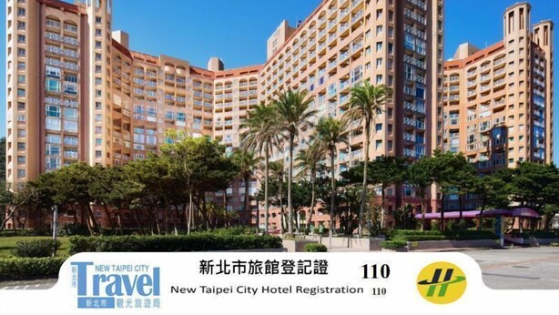 A multi-story hotel with a curved facade, numerous balconies, and a registration number 110.