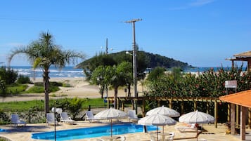 2 outdoor pools, pool umbrellas, pool loungers