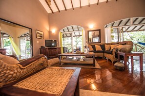 Luxury Suite, 2 Bedrooms, Ocean View (Luxury Suite) | Living area | 32-inch TV with cable channels, DVD player