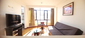 Superior Suite | Living area | 42-inch LED TV with digital channels, books, streaming services