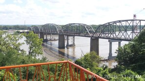 A large metal bridge spanning a river with a date stamp of 09.12.2018 1:21 AM.