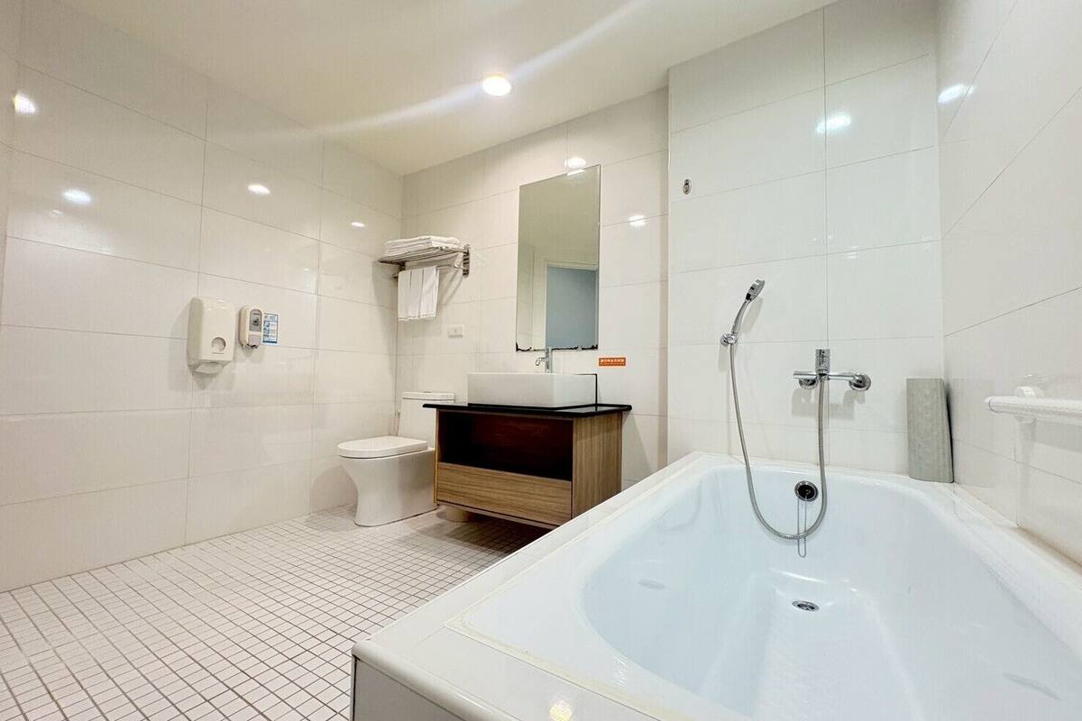 deluxe triple room | bathroom | free toiletries, hair dryer, slippers, towels