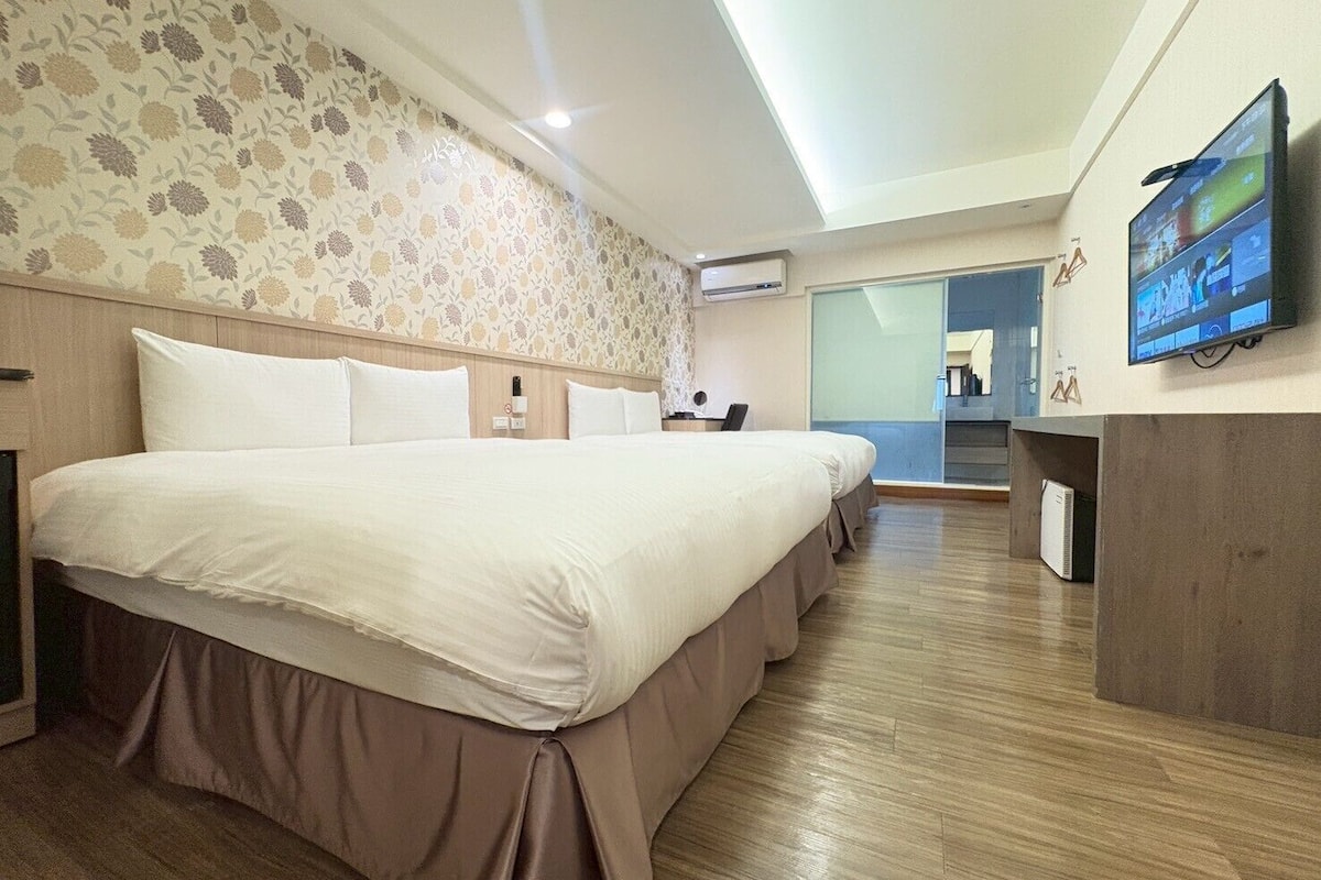 family room, 2 queen beds | premium bedding, desk, laptop workspace, cots/infant beds