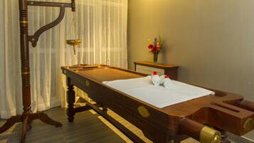 Enjoy a game of pool in this classic room with a billiards table and cue sticks.
