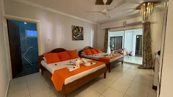 Standard Quadruple Room, 2 Queen Beds | Minibar, in-room safe, desk, free WiFi