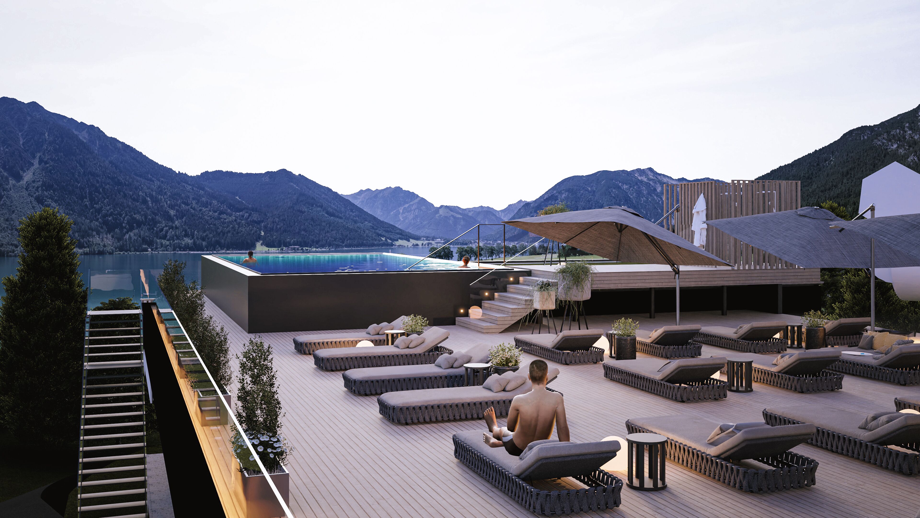 Un salon sur le toit avec des espaces de détente en plein air, une piscine et une vue sur les montagnes.