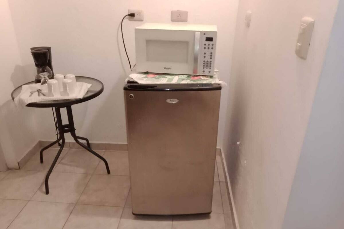 basic single room, 1 queen bed | private kitchen | fridge, coffee/tea maker, dining tables