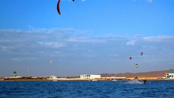 On the beach, surfing, kayaking