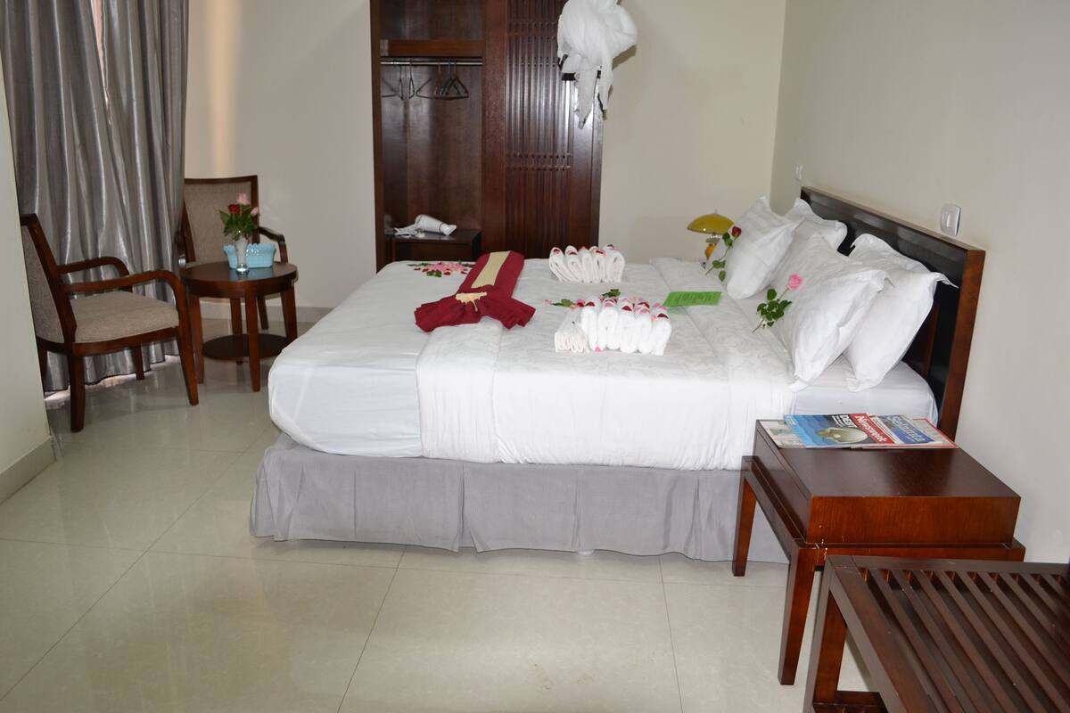 Premium bedding, desk, laptop workspace, soundproofing