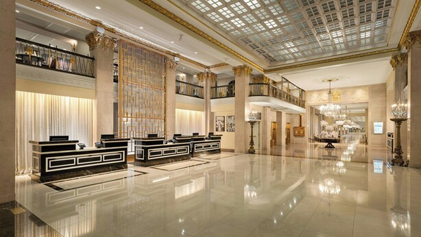 A spacious lobby with a reception desk, a high ceiling with a skylight, and a chandelier. - Marriott Vacation Club® at the Mayflower, Washington, D.C. (Washington)