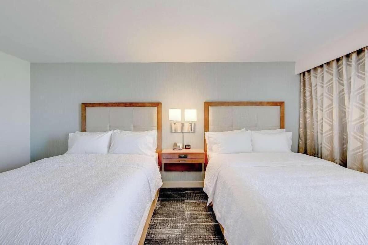 Premium bedding, desk, laptop workspace, iron/ironing board