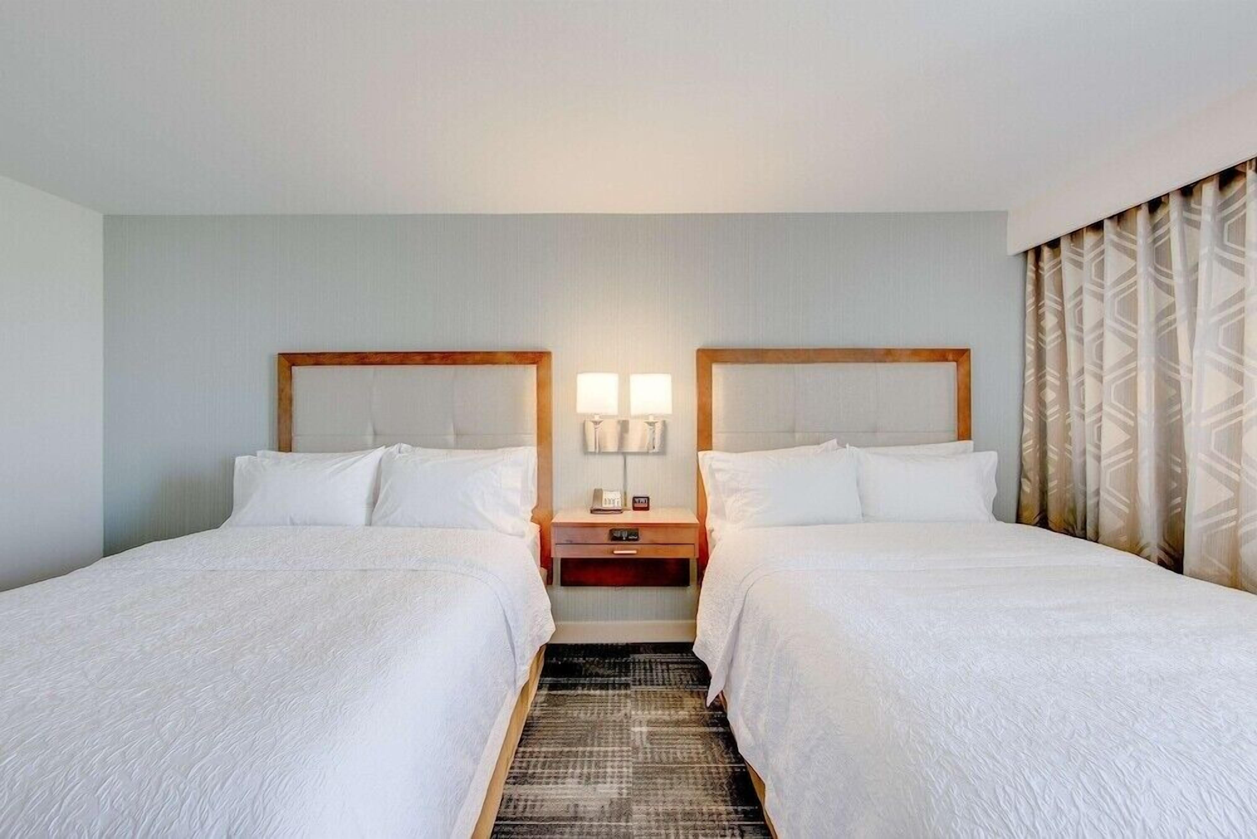 Premium bedding, desk, laptop workspace, iron/ironing board