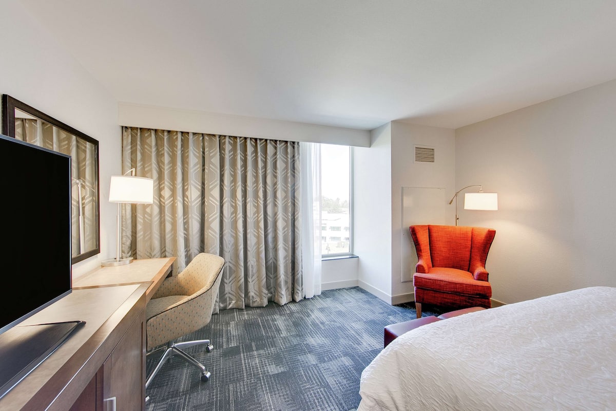 Premium bedding, desk, laptop workspace, iron/ironing board