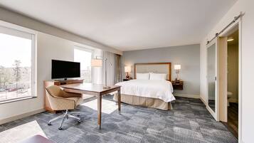 Premium bedding, desk, laptop workspace, iron/ironing board