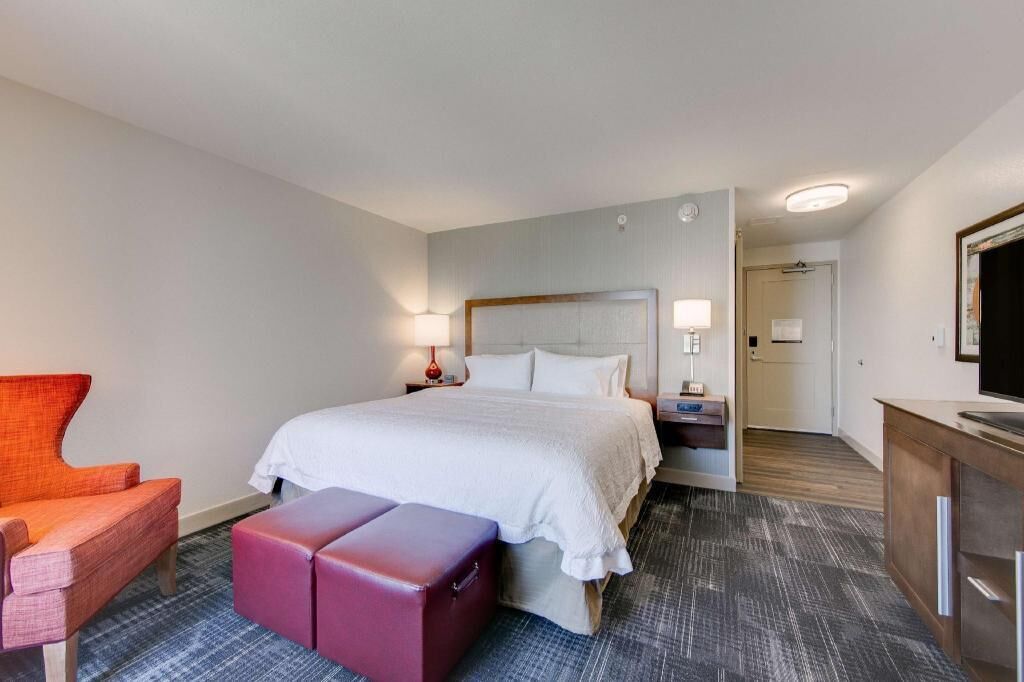 Premium bedding, desk, laptop workspace, iron/ironing board
