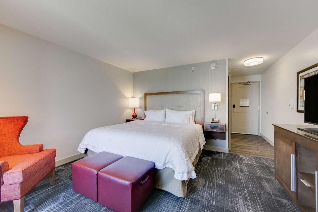 Premium bedding, desk, laptop workspace, iron/ironing board