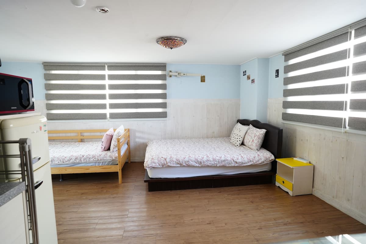 Hypo-allergenic bedding, desk, laptop workspace, blackout curtains