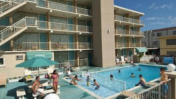 Seasonal outdoor pool, open 9:00 AM to 8:00 PM, pool umbrellas