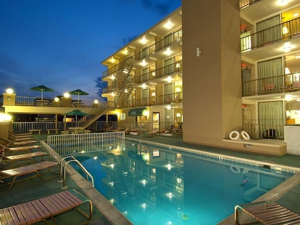 Seasonal outdoor pool, open 9:00 AM to 8:00 PM, pool umbrellas